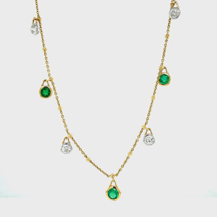 Unique style  5 round emeralds 1.40 cts  Great hue color  5 round diamonds 1.10 cts  F/G color  Set in 18 yellow gold  Secure lobster clasp  18" long