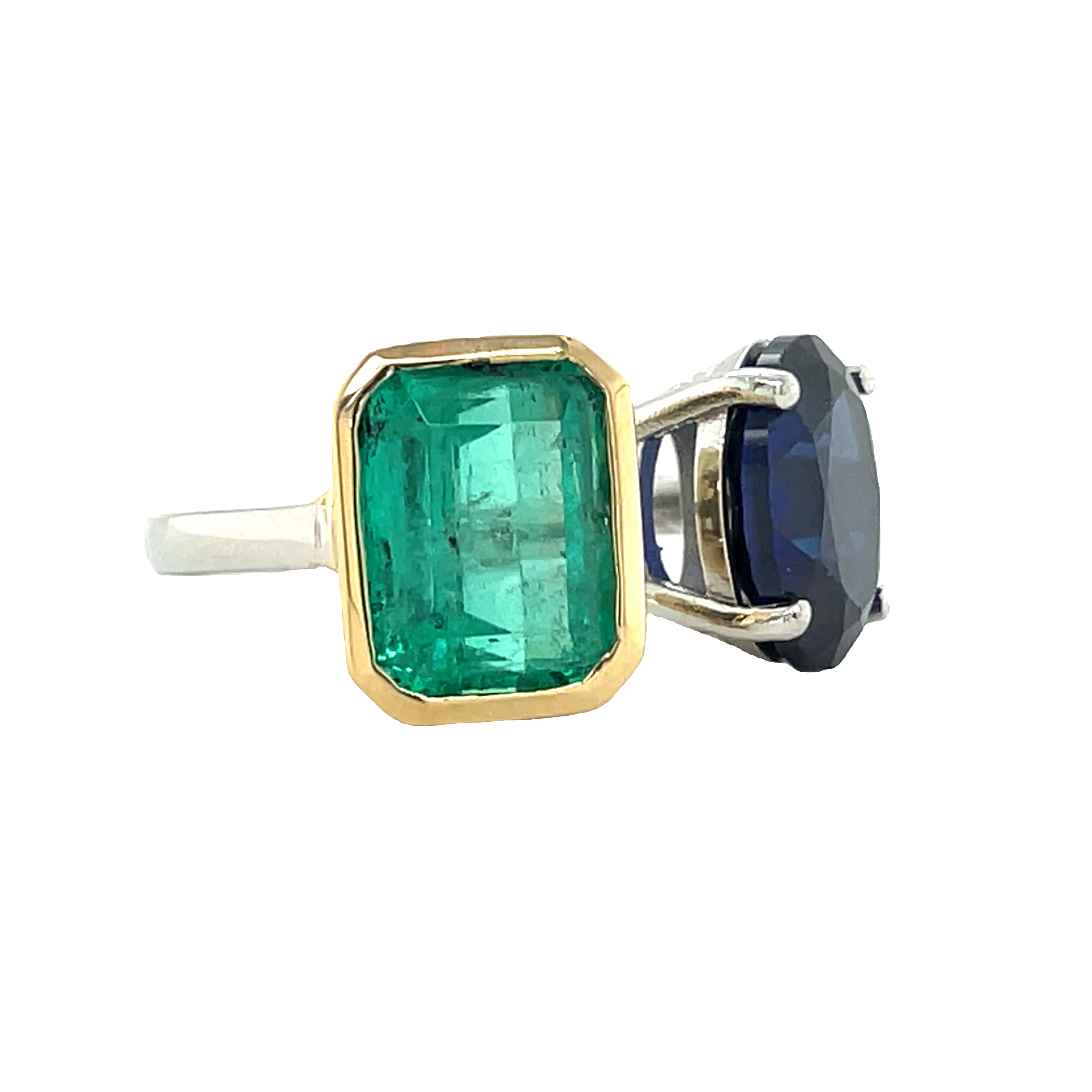 Beautiful custom made ring  Platinum & 18k yellow gold setting  Colombian emerald (emerald cut) 4.71 cts bezel set in yellow gold  Oval tanzanite 3.62 cts set four prong basket.  Toi & Moi design  12.00 x 12.00 mm   2.30 mm wide  Size 6.5 (sizeable)