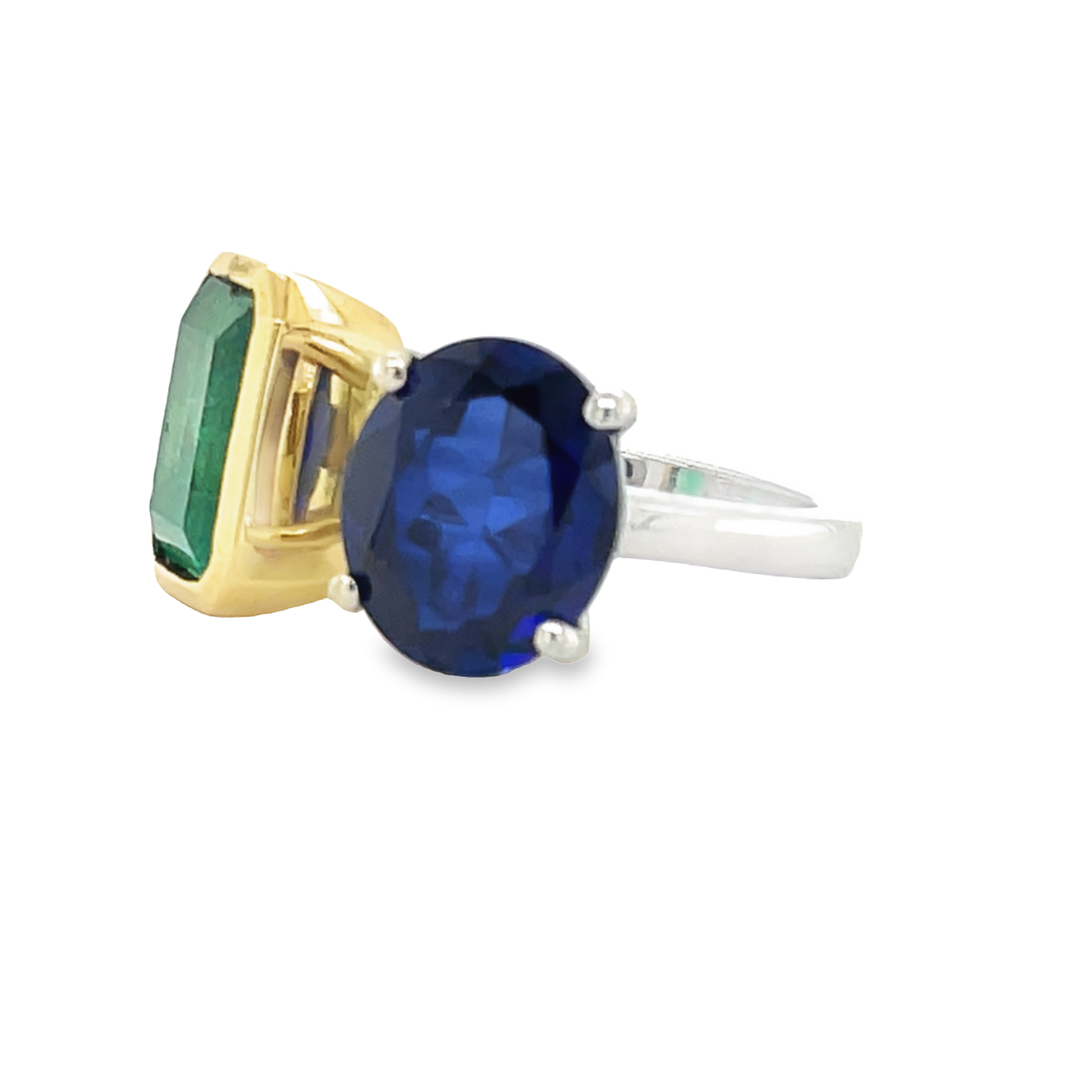 Beautiful custom made ring  Platinum & 18k yellow gold setting  Colombian emerald (emerald cut) 4.71 cts bezel set in yellow gold  Oval tanzanite 3.62 cts set four prong basket.  Toi & Moi design  12.00 x 12.00 mm   2.30 mm wide  Size 6.5 (sizeable)