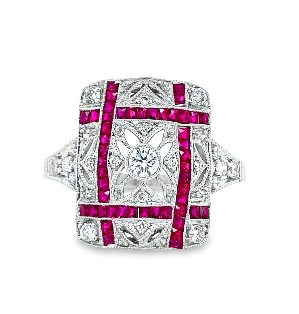 Handmade design  Round rubies 0.60 cts  Round diamonds 0.29 cts  Set in a 14k white gold   Size 6.5 (sizable)  Art deco geometrical style.  Carved into filigree pattern.