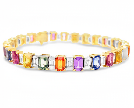 18 yellow gold  Italian made  Sapphire colors ranging from orange, yellow, green, purple, blue & pink  Emerald cut sapphires 16.72 cts  Emerald cut diamonds 2.08 cts   7" long  6.30 mm wide  Gallery finish
