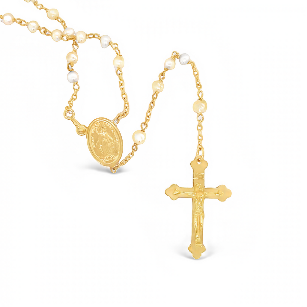 Constructed from 18K yellow gold, this exquisite Italian-crafted rosary necklace features 3.00mm coral beads sourced from Corsica, a matte finished Virgin medallion and a high-polished crucifix. Measuring 29" in length, it is finished with a Cross charm.