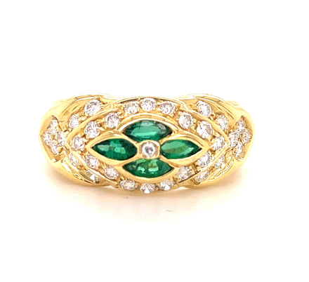 18k yellow gold  Surrounded by white round diamonds    Four marquise emeralds   9.50 mm.