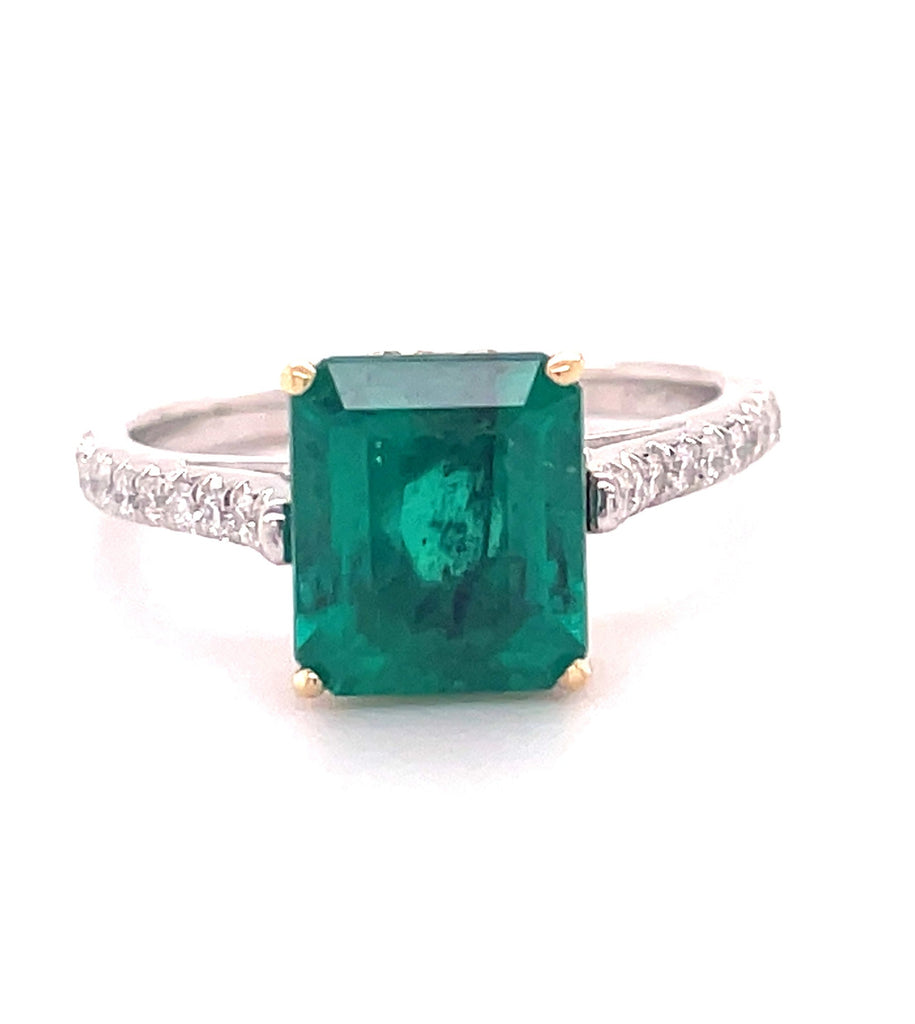 Indulge in timeless elegance with this luxurious Emerald Ring Set in 22k Yellow Gold & Platinum. Featuring a 2.40 ct emerald cut emerald center stone, surrounded by round diamonds 0.60 cts for an exquisite look. Crafted to last, this statement piece will be cherished for years to come.