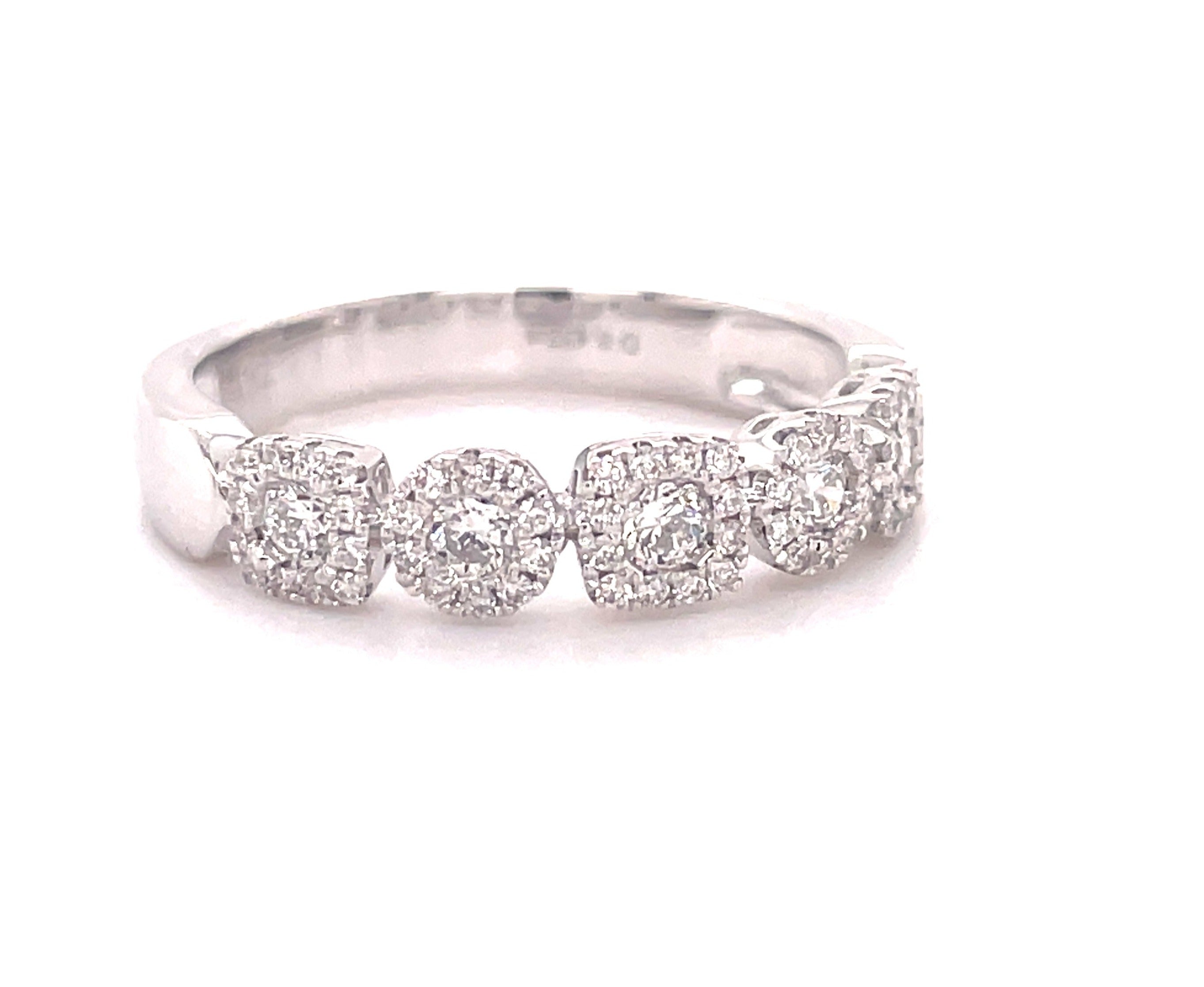 This stunning diamond cluster band features two circles and three squares of round diamonds totaling 0.50 carats, set in 18 karat white gold and is size 6.5 (resizable). The band measures 4.50 mm in width.