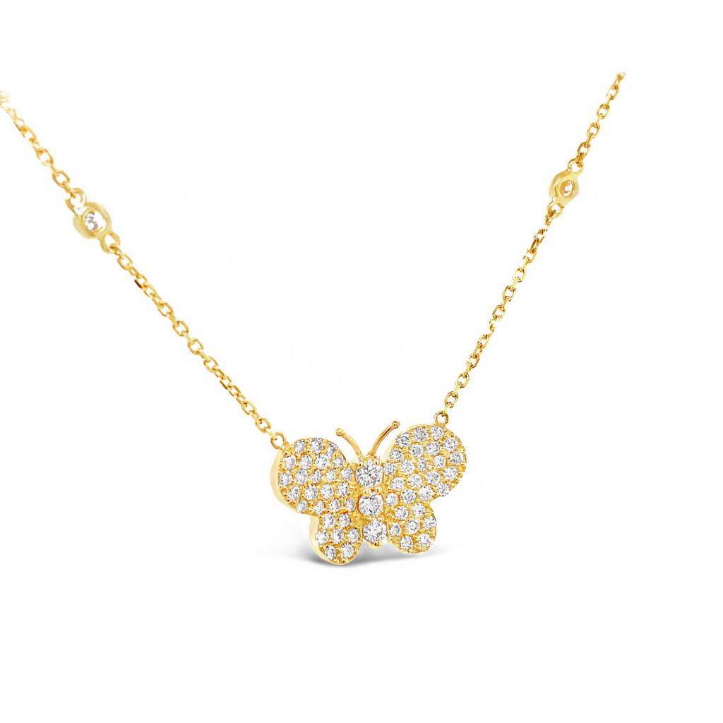 Exquisitely crafted in 18kt yellow gold, this diamond butterfly pendant shines with 1.15 cts of round diamonds. It measures 19.00 mm x 13.00 mm with a 2.00 mm thick and has a gallery finish at the back. The 17" yellow gold chain is adorned with 4 additional dazzling round diamonds.