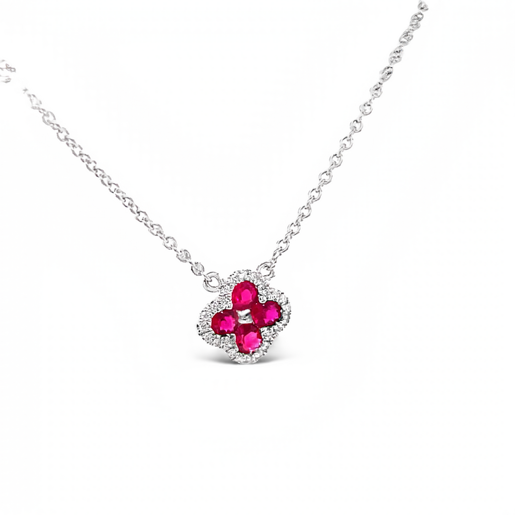 Diamond clover necklace 0.10 cts  Round rubies 0.25 cts   Color F/G  Clarity VS1  Set in 18 white gold   17" long with sizable loop at 16"  8.00 mm 