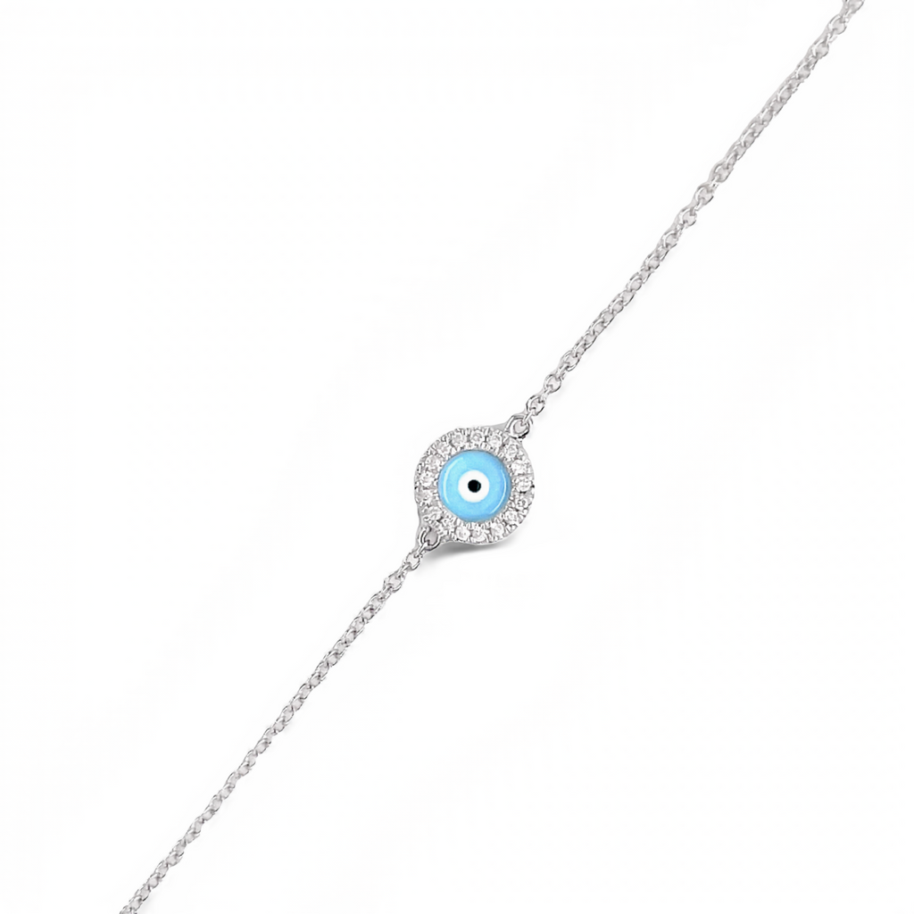 Gracefully adorn your wrist with this delicate 14k white gold bracelet boasting a lobster clasp, 0.05 cts small diamonds, and a light blue enamel evil eye design. An adjustable 7" length chain with an additional sizing loop at 6.5" offers an ideal fit.