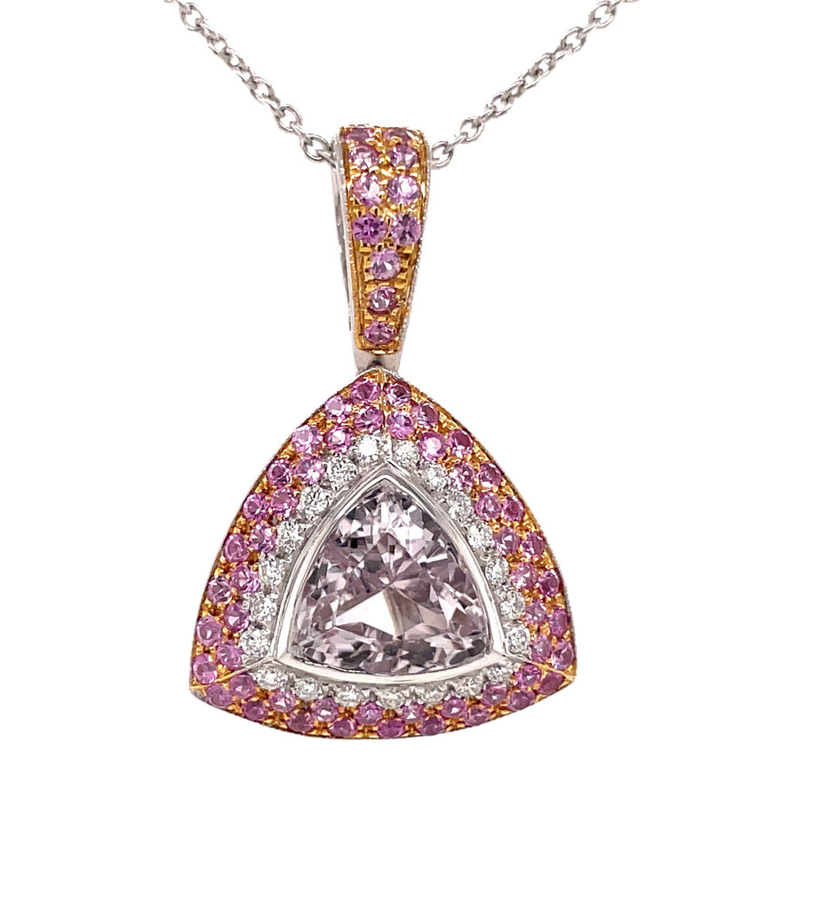 Italian made  Faceted pink topaz trillion shape 23.50 cts  30.00 x 20.00 mm  Set in 18k white gold mounting  White round diamonds 0.28 cts  Pink sapphires 1.26 cts   Enhancer   Gallery finish