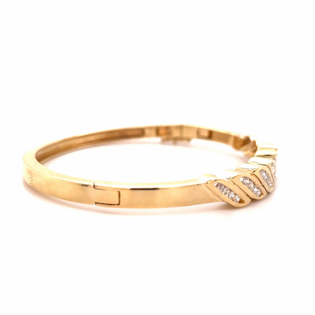 This 14 kt  yellow gold bracelet is 6.70 mm and 7" long. It features a secure figure 8 hidden clasp and round diamonds. This classic bracelet will make a lasting piece for your collection.