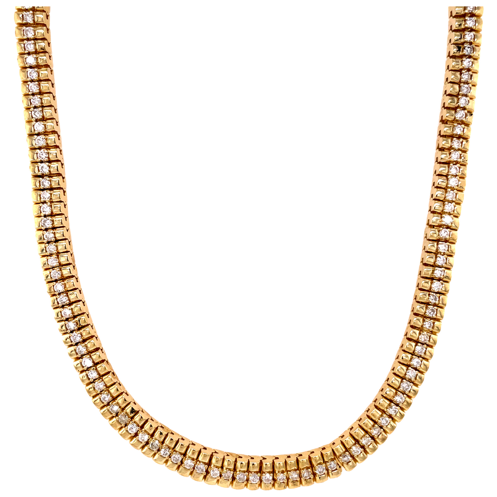 Vibrant 14k yellow gold gleams graciously, setting off round diamonds totaling 7.00 cts. An 18" long, 11.30 mm beauty that radiates with grandeur. An exquisite piece in great condition, with a hidden clasp for a perfect finish.