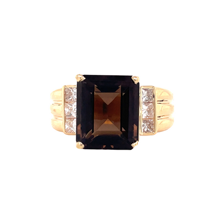 This exquisite 14k yellow gold estate jewelry ring features a 12.00 x 10.00 mm, emerald-cut brown topaz and boasts a substantial shank. Combined with its excellent condition, this beautiful piece is something you won't want to miss.