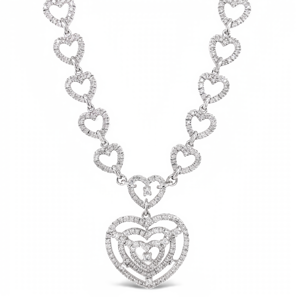 Lustrous 14k white gold glimmers with captivating round diamonds in great condition. A 15" long chain with a reliable double figure 8 catch, suspends an elegant 23.00 mm diamond pendant.