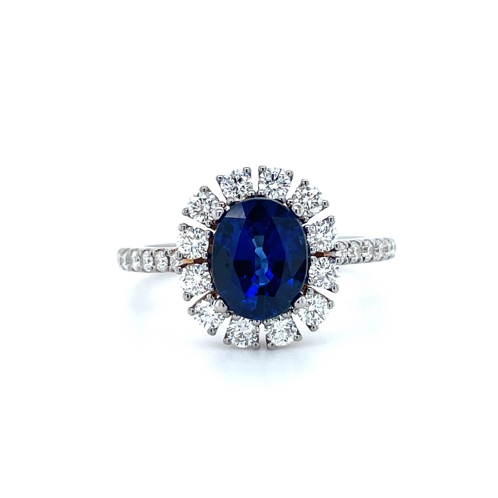 Set in 18k white gold mounting  One round blue sapphire 1.93 cts  Round diamonds prong set & in the band 0.81 ct  Size 6 (sizeable)