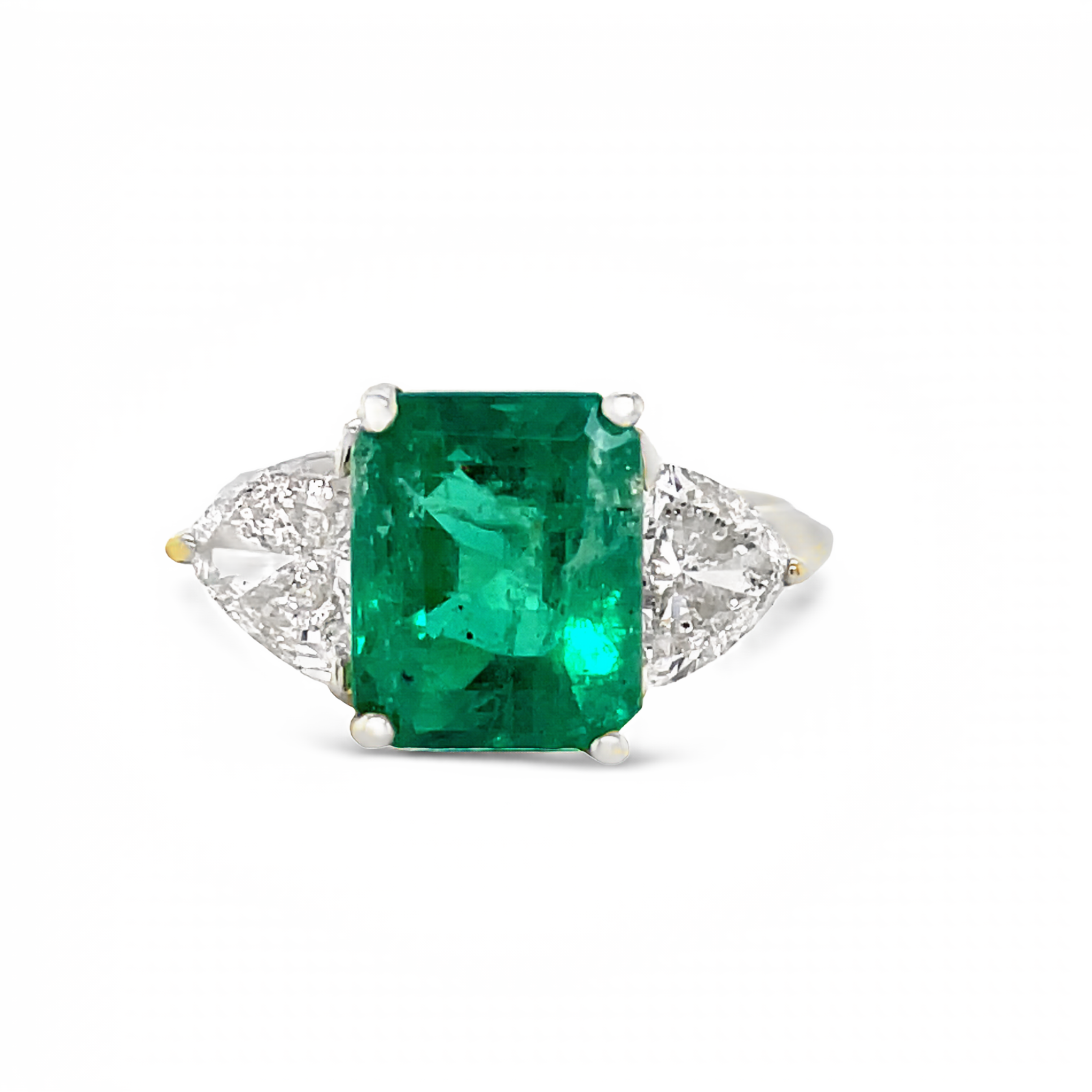 This stunning Muzo Mines emerald, boasting a 3.00 carat emerald cut, is the centerpiece of this 18k yellow gold ring. Accompanying it are two trillion cut diamonds weighing 1.30 carats, and the band measures 10.00 millimeters in width.