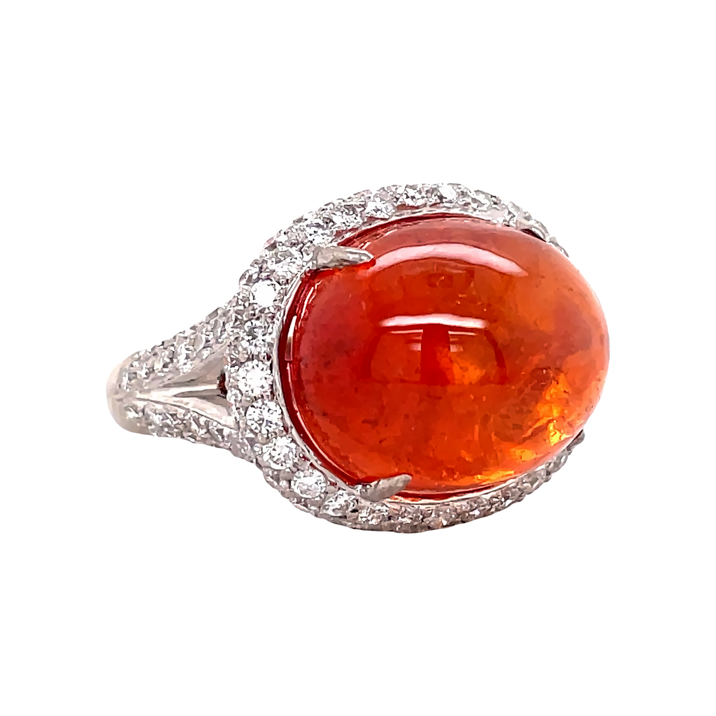 A spectacularly rare cabochon-cut Mexican Fire opal is set in 18k white gold, surrounded by a dazzling pave of 0.80 cts of diamonds. The split shank adds to the beauty of the ring. Size 7 (can be resized).