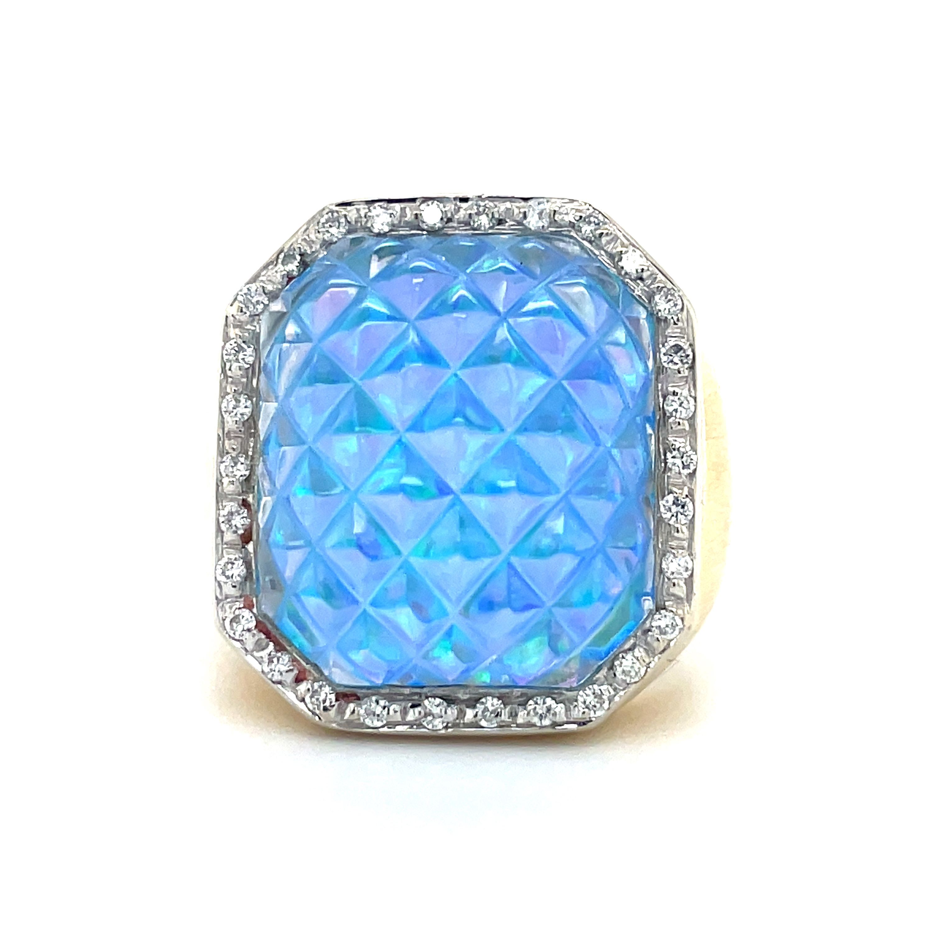 The Blue Sand Spike Glass Diamond Ring is from the Pascale Bruni Collection and crafted in 18k yellow gold. This Italian-made ring features a 7.0 size (sizable) with a special spike glass inlay of thin opal, and is adorned with round diamonds at 0.24 cts.