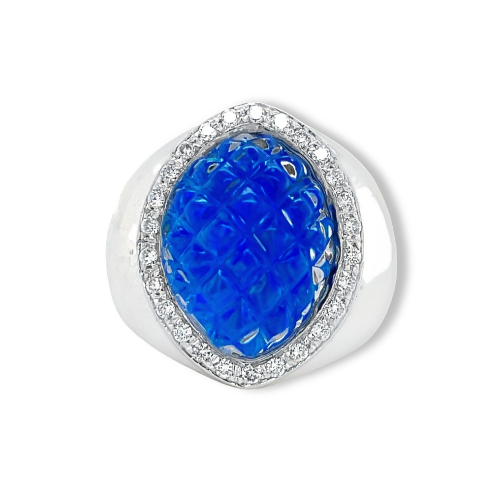 The Blue Spike Glass Diamond Ring is from the Pascale Bruni Collection and crafted in 18k white gold. This Italian-made ring features a 7.0 size (sizable) with a special spike glass inlay of thin opal, and is adorned with round diamonds at 0.24 cts.