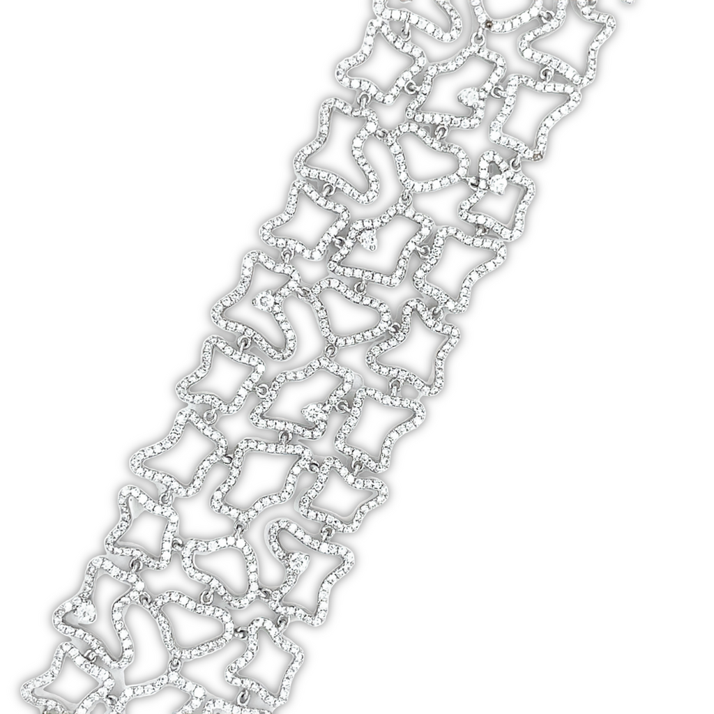 This 18k White Gold Wide Diamond Lattice Bracelet features high quality diamonds weighing 6.19 cts, with an E/F color grade. The width of the bracelet is 1.5" and each side of the sizing loop is 1.5". It is secured with a lobster catch and is 8" long. An incredible piece to behold.