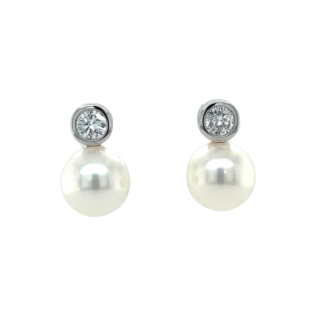 A timeless jewelry staple made with genuine Akoya cultured pearls (9.00 mm) and round diamonds (.60 cts) of F/G color and clarity, set in 14k White Gold. Secure friction backs make these earrings a beauty you can trust.