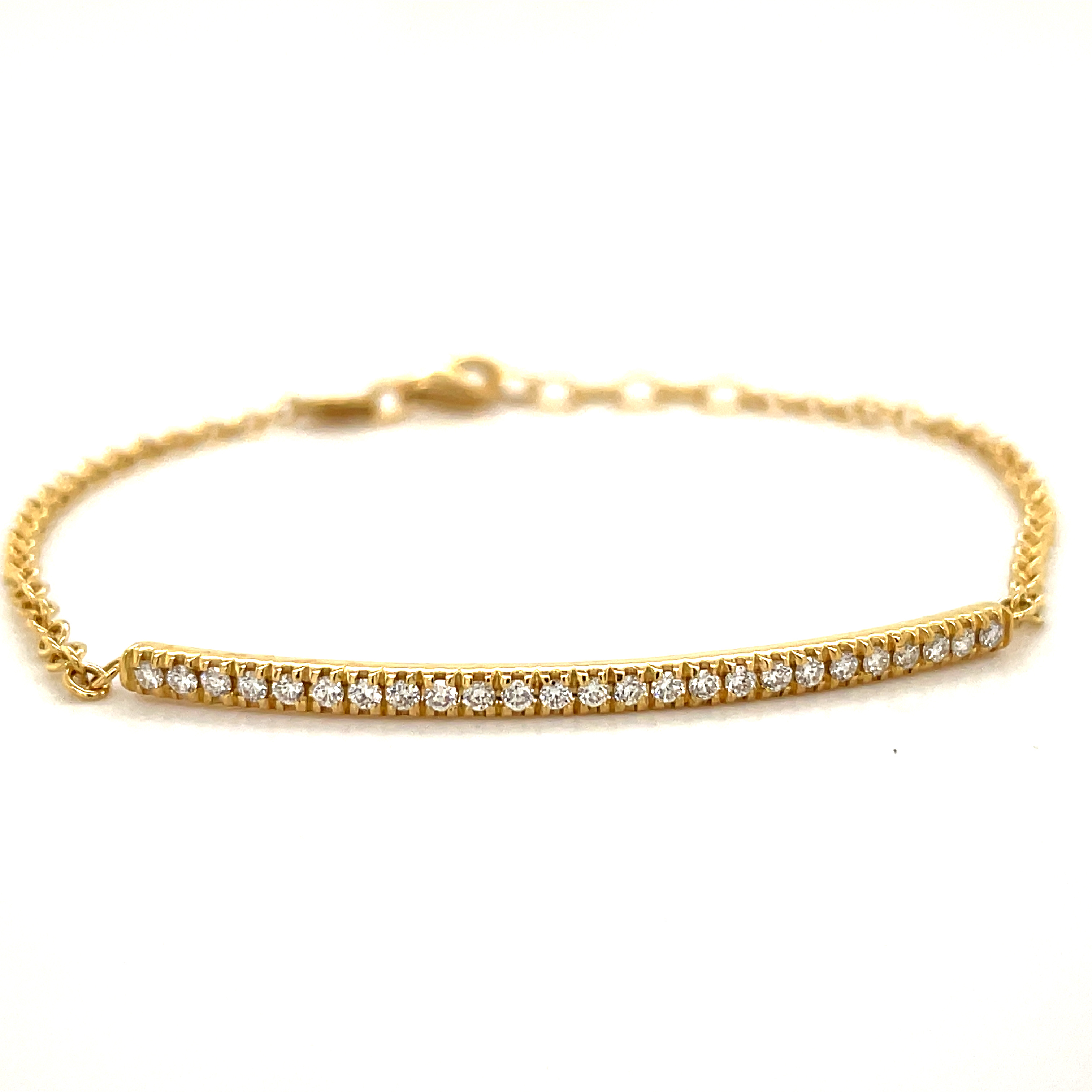 Italian made  Everyday bracelet that are easy to stack.  Set in 18k yellow gold mounting.  7" long with sizing loops  Round diamonds 0.78 cts   F/G color