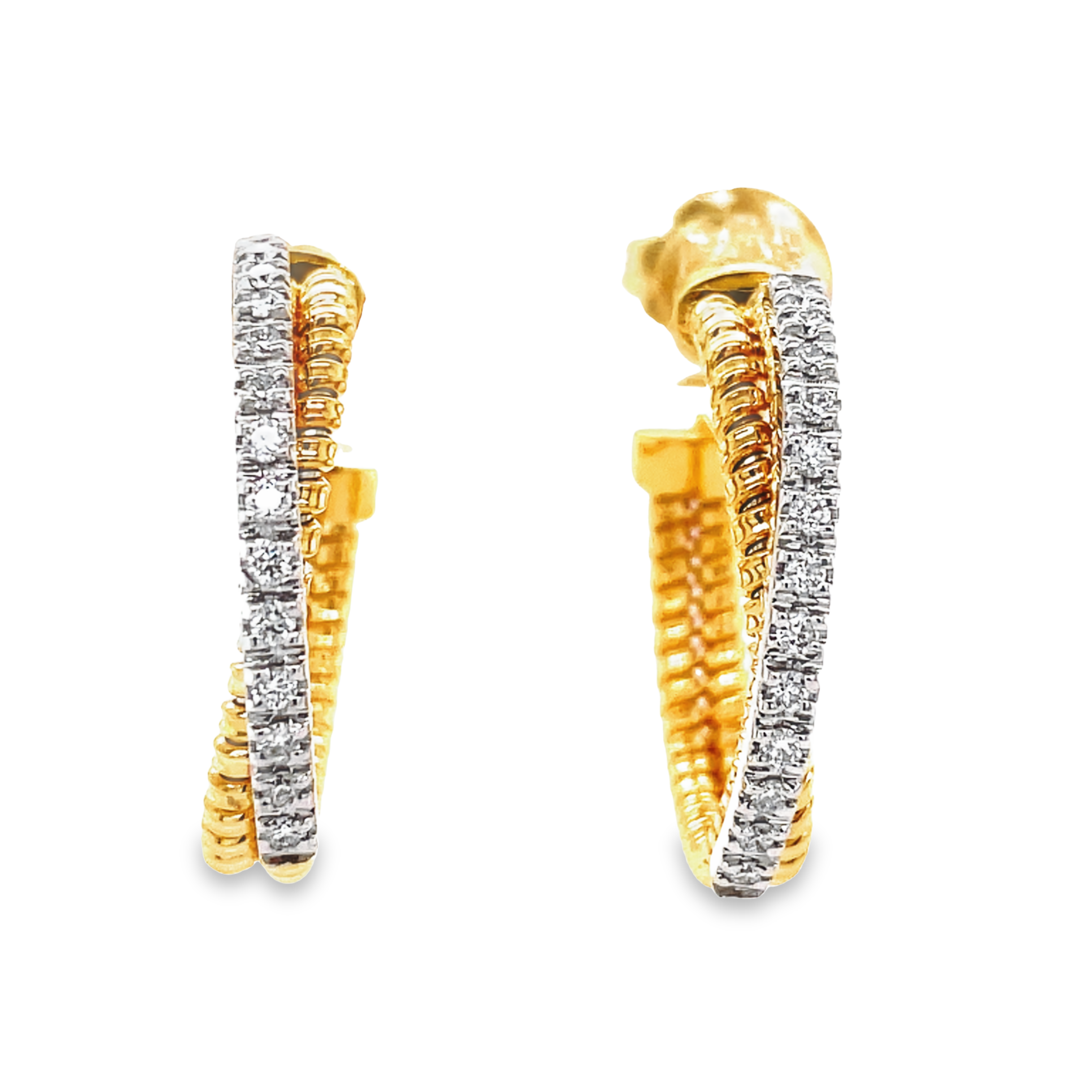 Italian craftsmanship, featuring Tubo gas technique, yields an adjustable design for the stunning hoop earrings. These 18K yellow gold semi-diamond hoops offer a combination of classic and contemporary styling with 0.33 carats of round diamonds at 3.10 mm width. They measure 1” in diameter.
