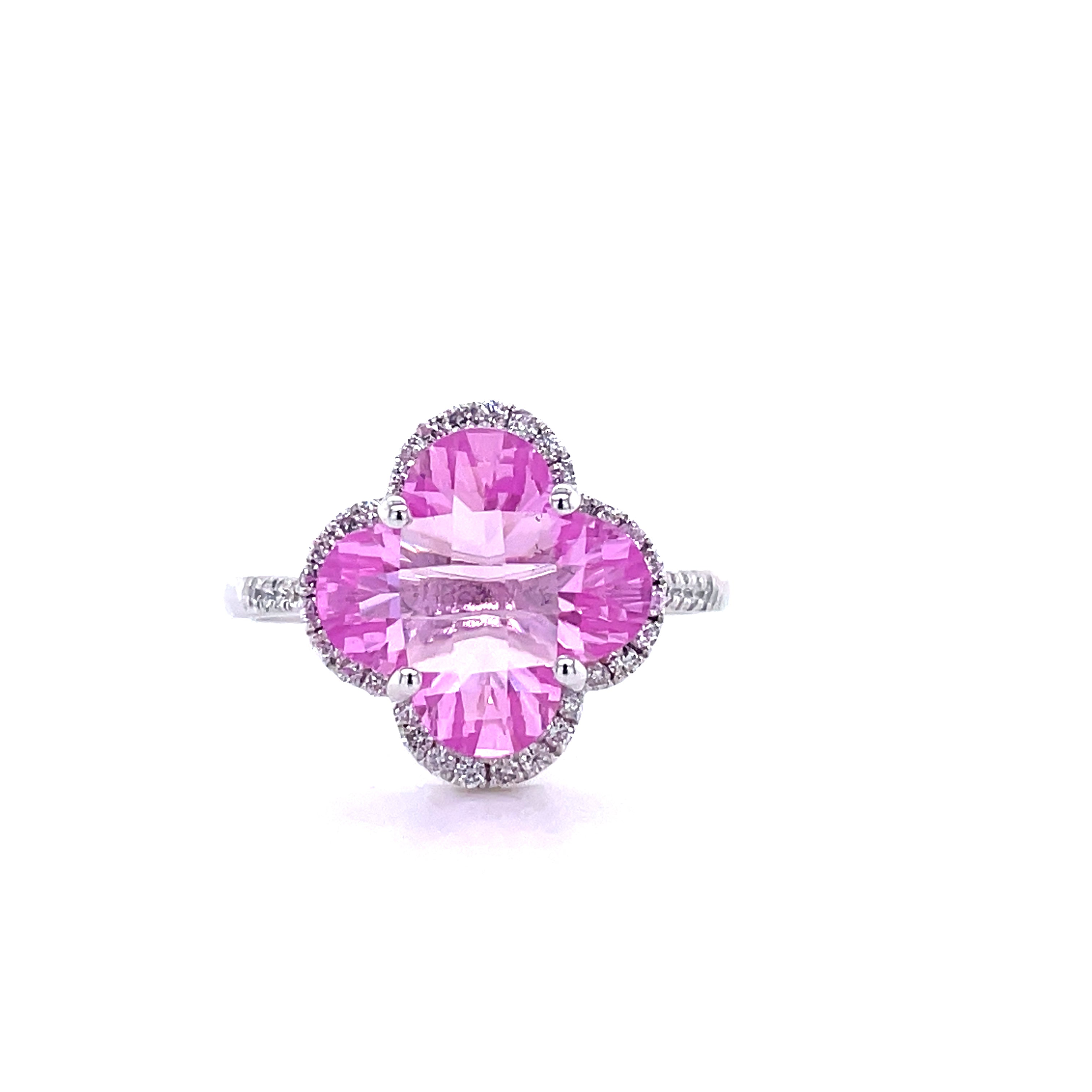 18k yellow gold  Surrounded by white round diamonds 0.28 cts   Flower shape pink topaz 2.69 cts  6.5 size (sizeable)  12.00 mm width 