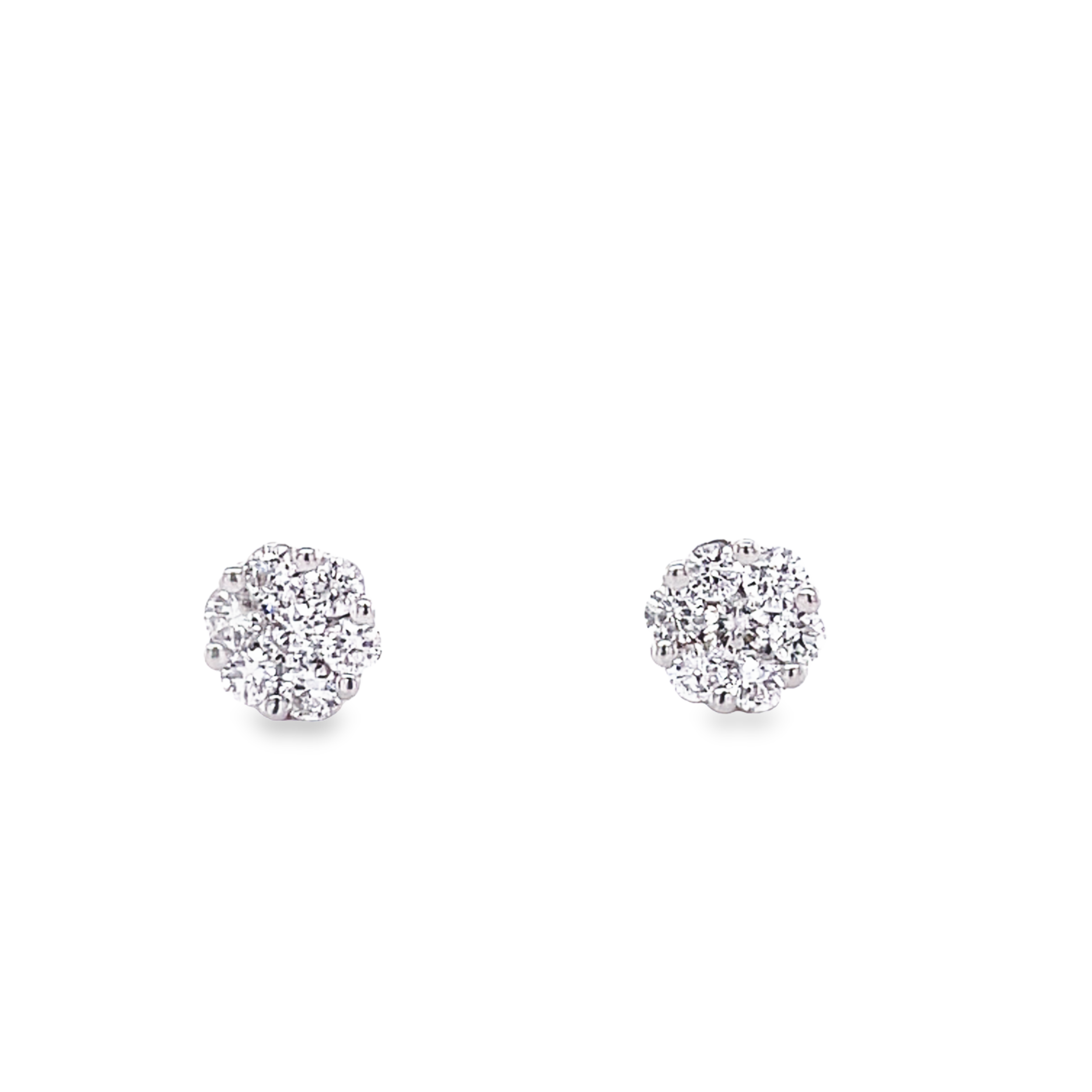 Dainty diamond earrings.   Flower motif   18k white gold  Secure heart shaped friction backs  Round diamonds 0.30 cts  6.00 mm.