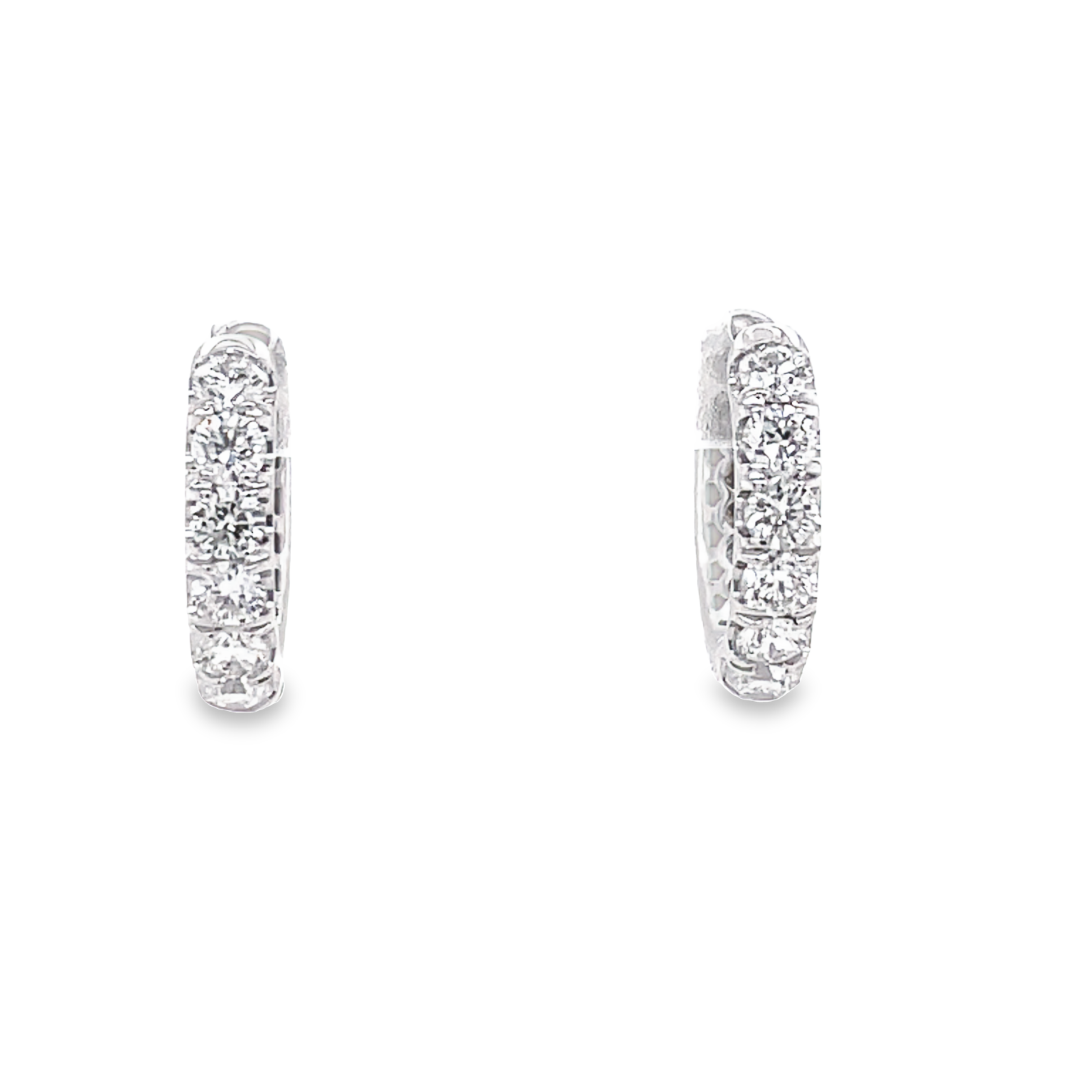 14k white gold.  Round diamonds 0.63 cts   12.00 mm long  Secure hinged system  Easy to wear