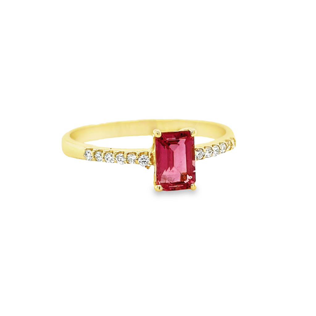 This dainty ring is lavishly set in 18k yellow gold, this impressive emerald cut pink tourmaline of 7.00 mm is magnificently paired with round diamonds of 0.12 cts! Size 7.5.