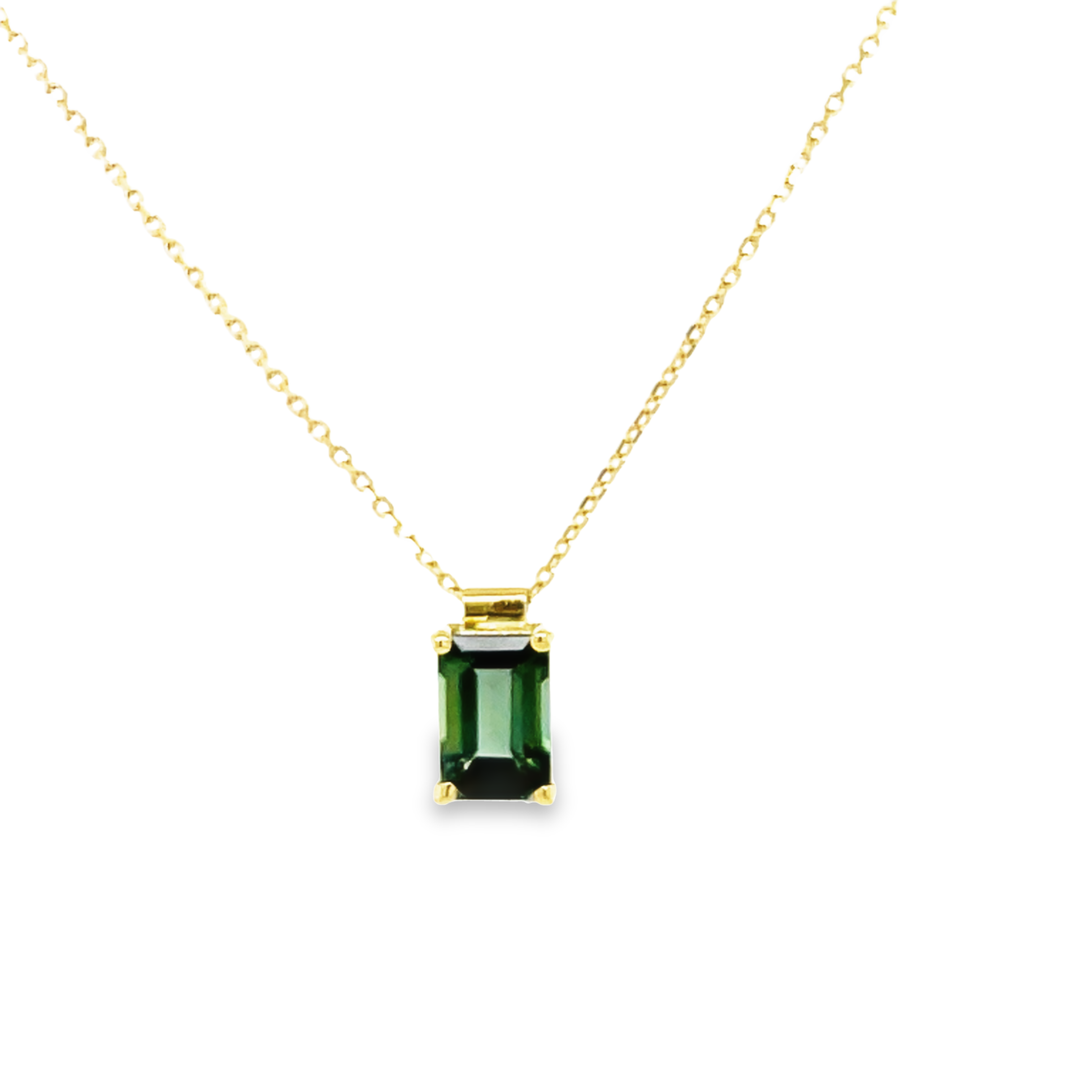 This striking 18k white gold green tourmaline baguette cut pendant of 0.40 cts, 8.00 x 5.00 mm (including bail) is perfectly complemented with the 18k yellow gold 18" chain - an exquisite piece!