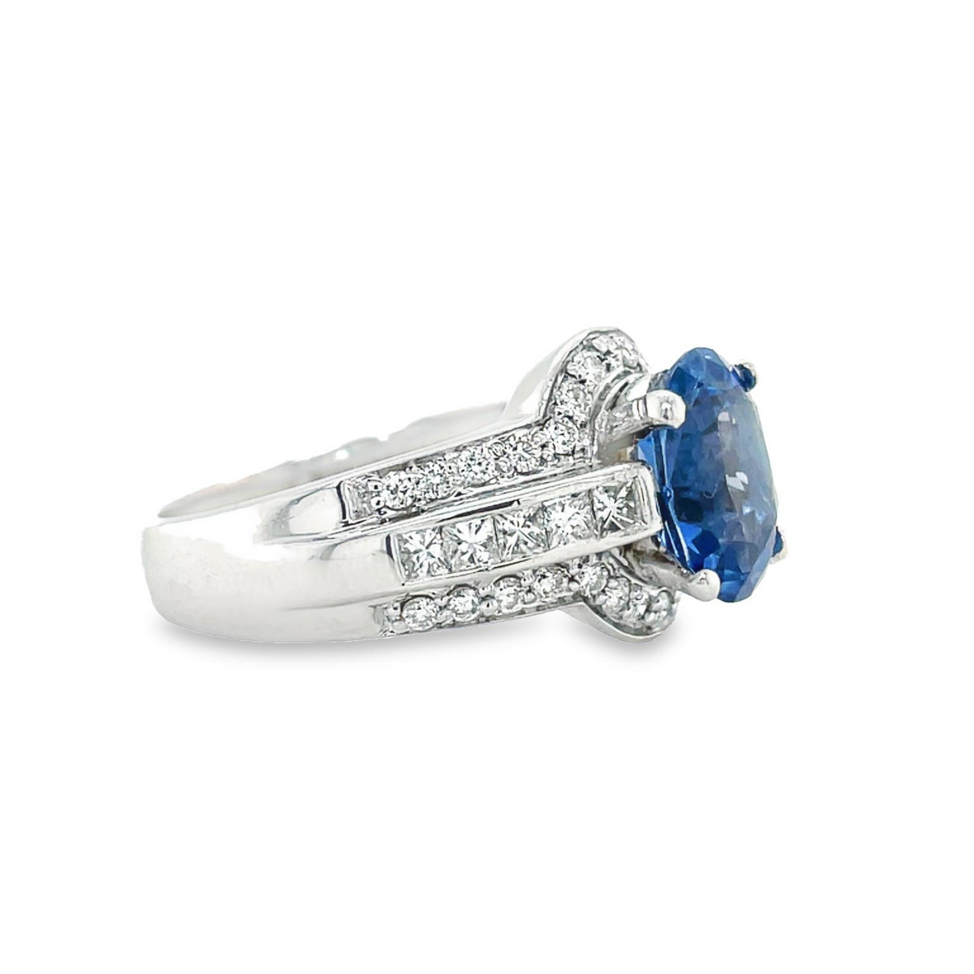 Oval Blue Sapphire Diamond Bezel Ring Profile View