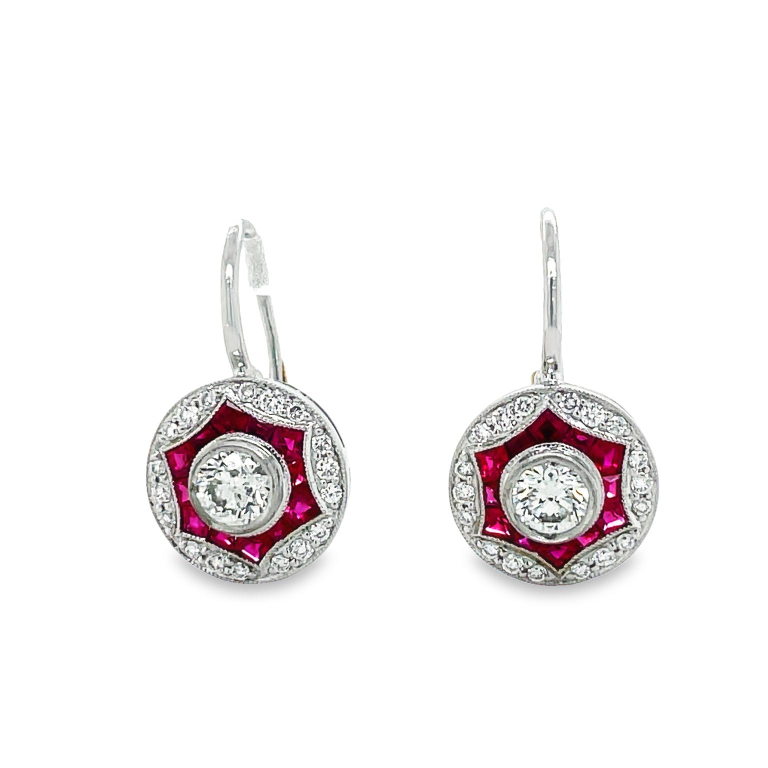 Art deco style dangling earrings   Two round diamonds 0.59 cts  Round diamonds 0.26 cts  Baguette rubies 0.64 cts   Set in platinum.  Secure hinged system