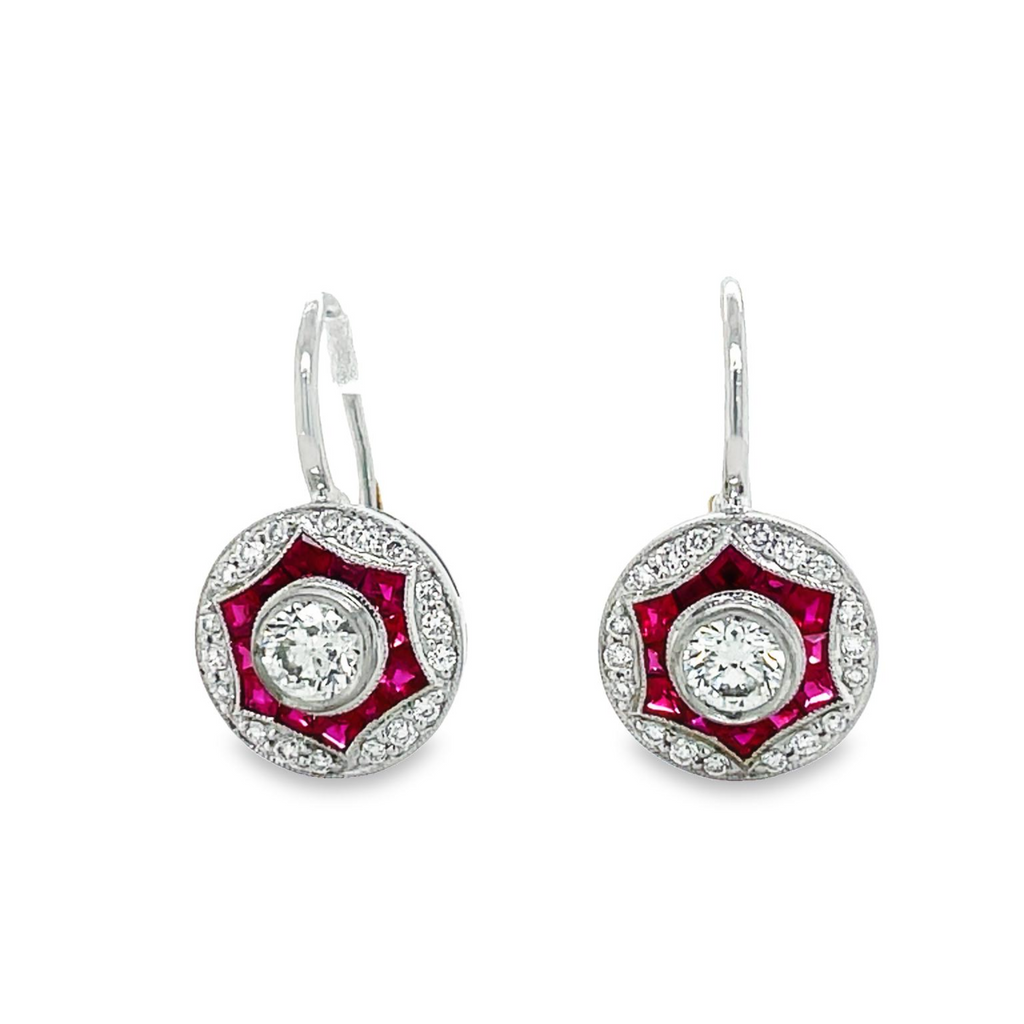 Art deco style dangling earrings   Two round diamonds 0.59 cts  Round diamonds 0.26 cts  Baguette rubies 0.64 cts   Set in platinum.  Secure hinged system