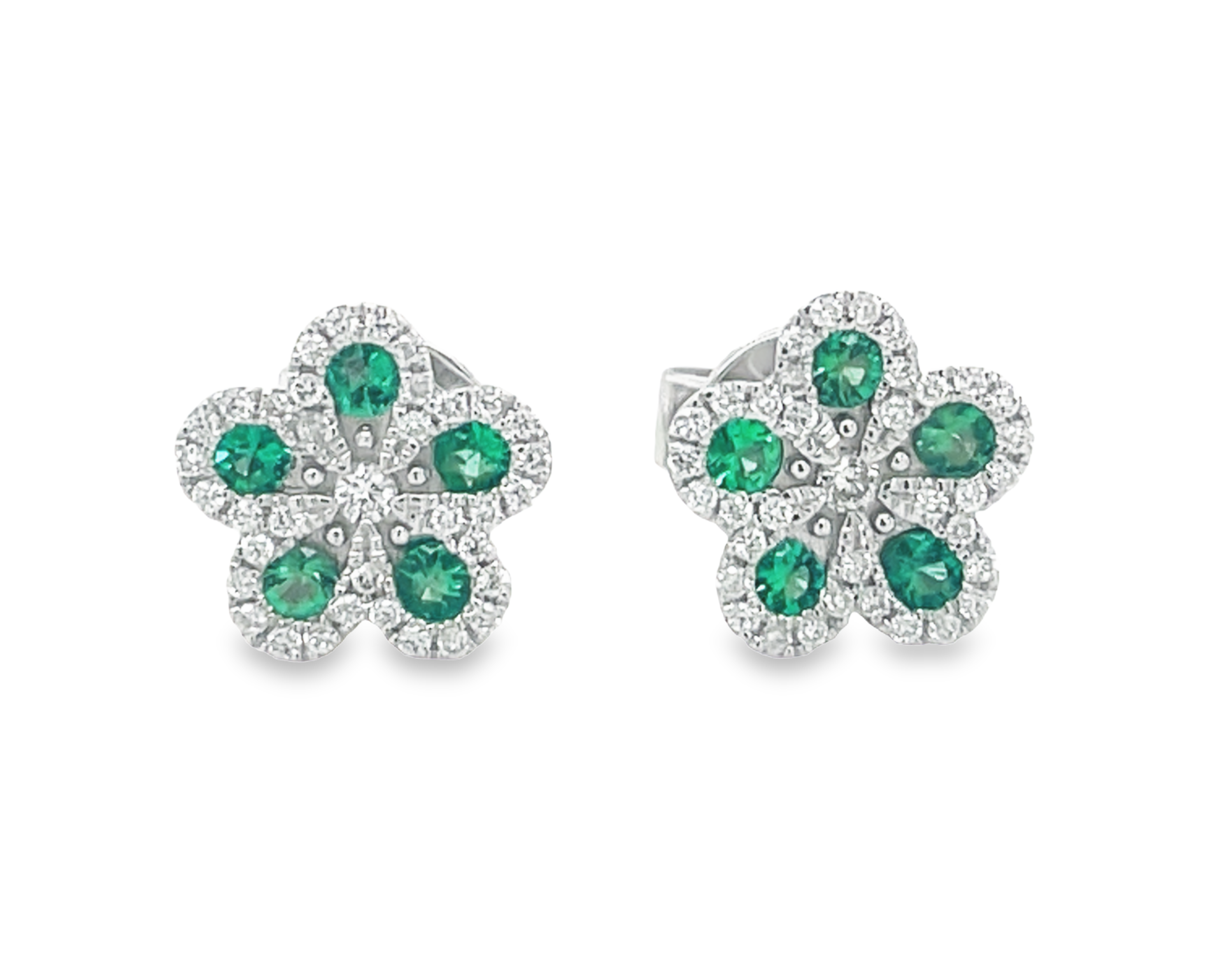 These 18k white gold earrings feature a beautiful flower motif set with round diamonds, 0.15 cts, and round emeralds, 0.20 cts, all in a luxurious 8.00 mm size and F/G color. Rest easy with secure friction backs.