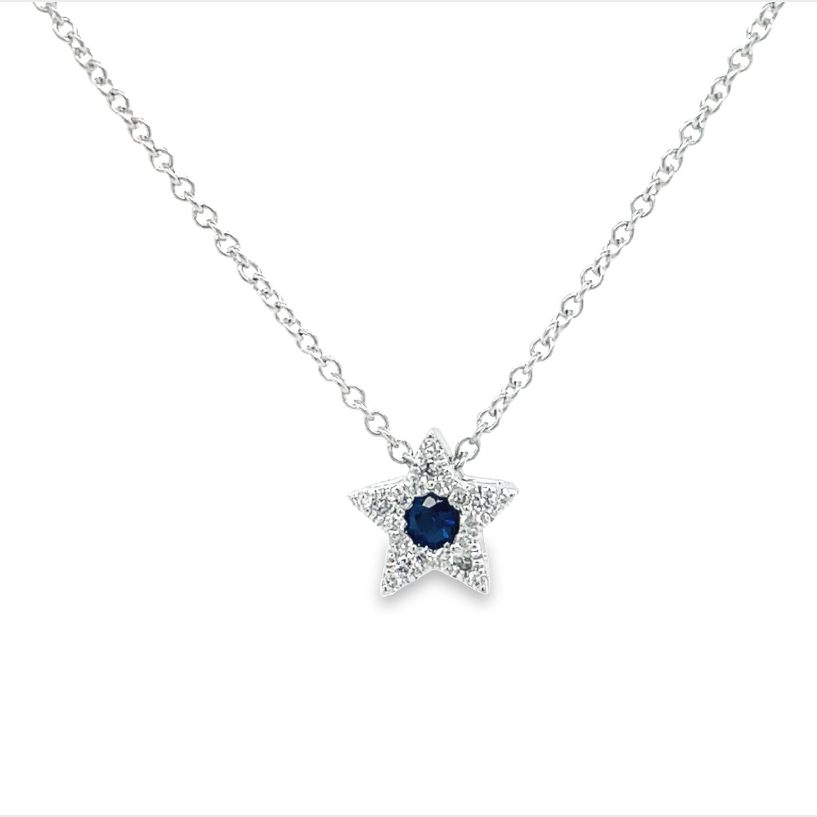 Beautifully crafted in 18k white gold, this 9.00 mm pendant features round diamonds of 0.15 cts and a round sapphire of 0.10 cts in a mesmerizing F/G color. All set on a delicate 16" white gold chain, this piece of jewelry will add a luxe touch to your style!