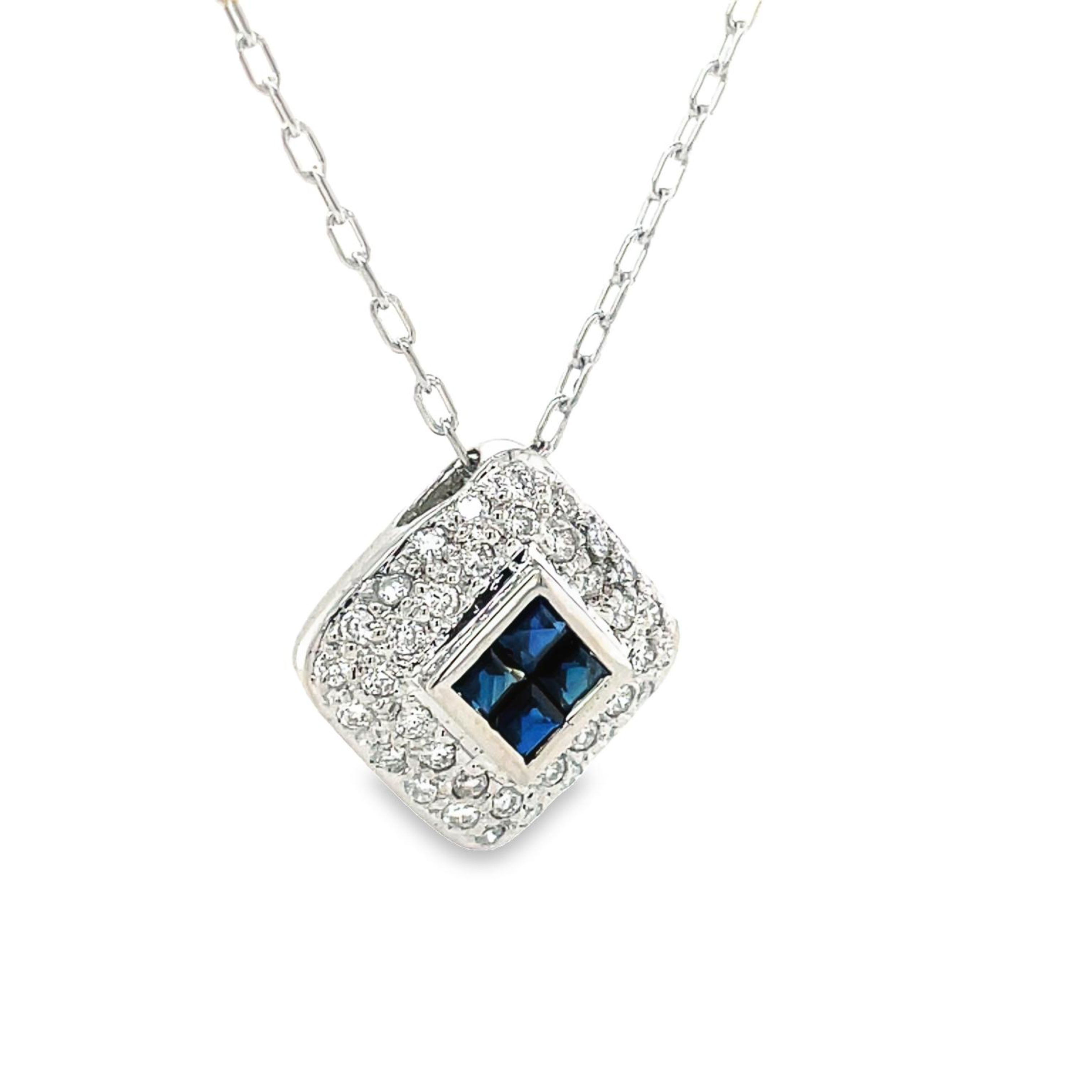 This stunning 14k white gold pendant necklace features 0.20 cts of round diamonds in E/F color and 0.70 cts of princess cut sapphires. Create elegant looks with the modern design of this tilted pendant necklace.