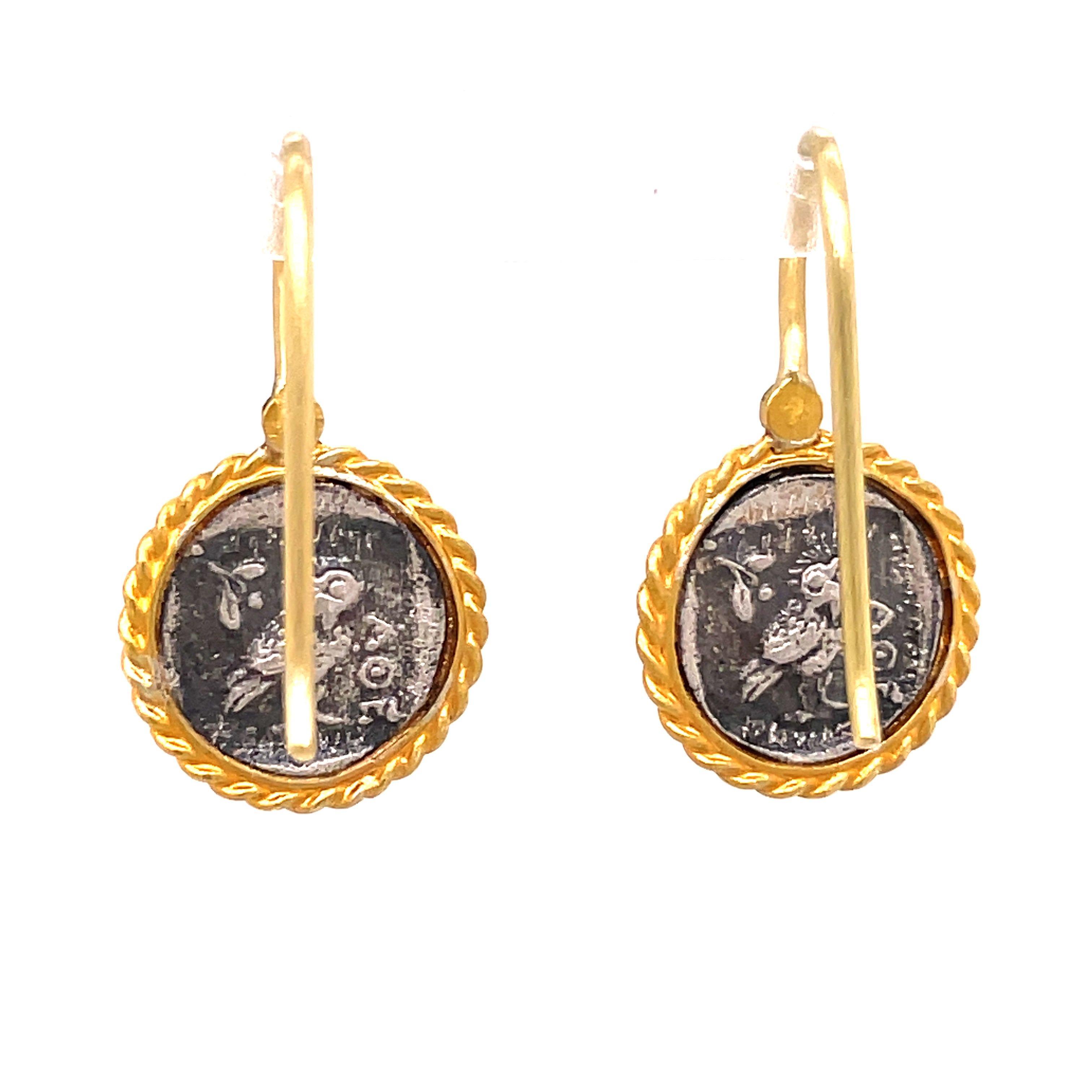 Made in Turkey, these Athena 24k Gold & Sterling Silver Coin Drop Earrings feature a round coin style, symbolizing wisdom and fertility. The hook wire system is highlighted by small round diamonds, while the earrings boast a matte finish. Oxidized sterling silver ensures long-lasting luxury.