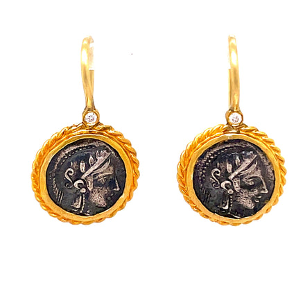 Made in Turkey, these Athena 24k Gold & Sterling Silver Coin Drop Earrings feature a round coin style, symbolizing wisdom and fertility. The hook wire system is highlighted by small round diamonds, while the earrings boast a matte finish. Oxidized sterling silver ensures long-lasting luxury.