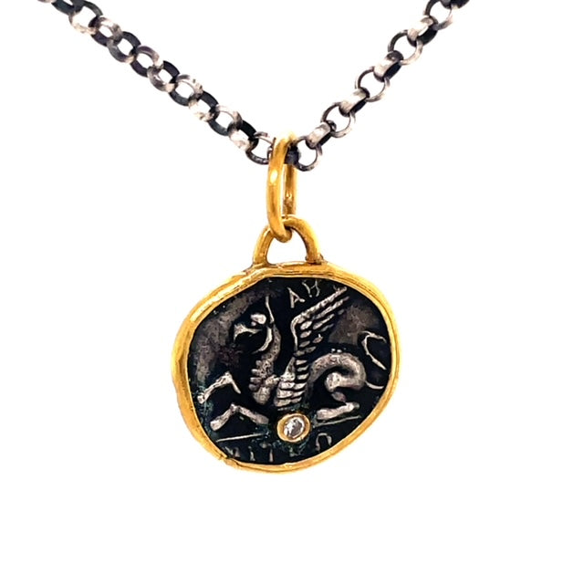 Round coin style   15.00 mm   24k gold  Matte finish   Small round diamond  Handmade in Turkey  Oxidized sterling silver chain with secure lobster catch ($75)  17" long.