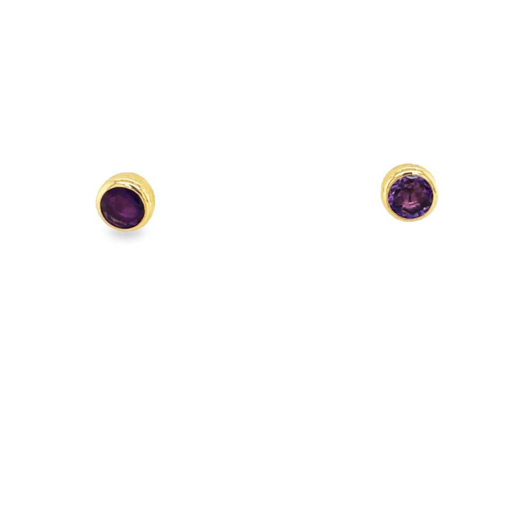 These sophisticated earrings are a beautiful addition to any collection, crafted with genuine 14k yellow gold and featuring a small, bezel-set amethysts for a subtle and stylish design. Designed with secure backs for all of life's adventures.