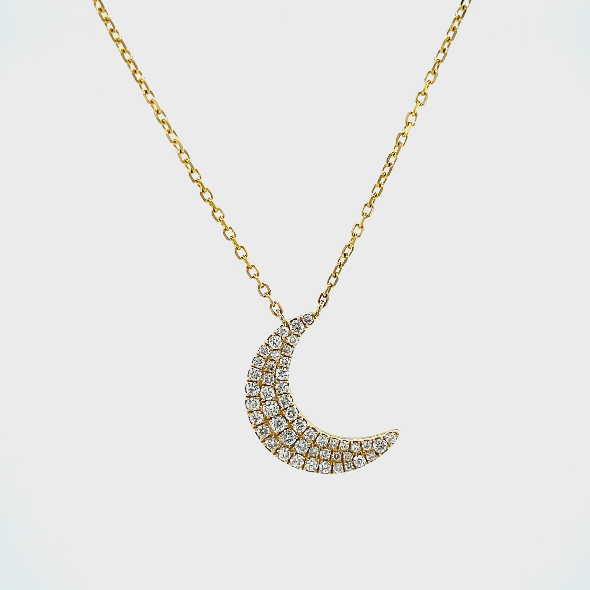 Behold the beauty of this 0.30 cts diamond crescent moon pendant necklace, set in 18K yellow gold. Securely attached to an 18" chain with a sizing loop at 16", this stunning piece will adorn you with elegance and grace.
