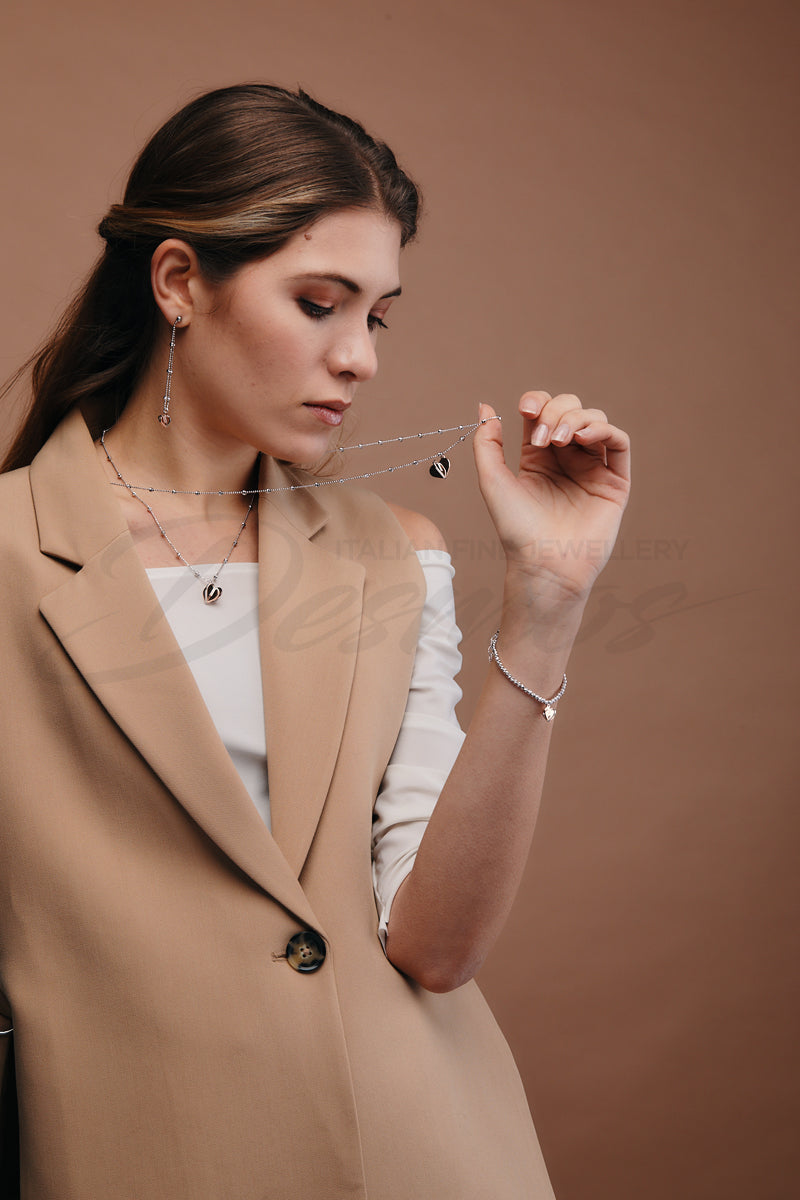 Try on view of Rose gold plated  heart bracelet fastened