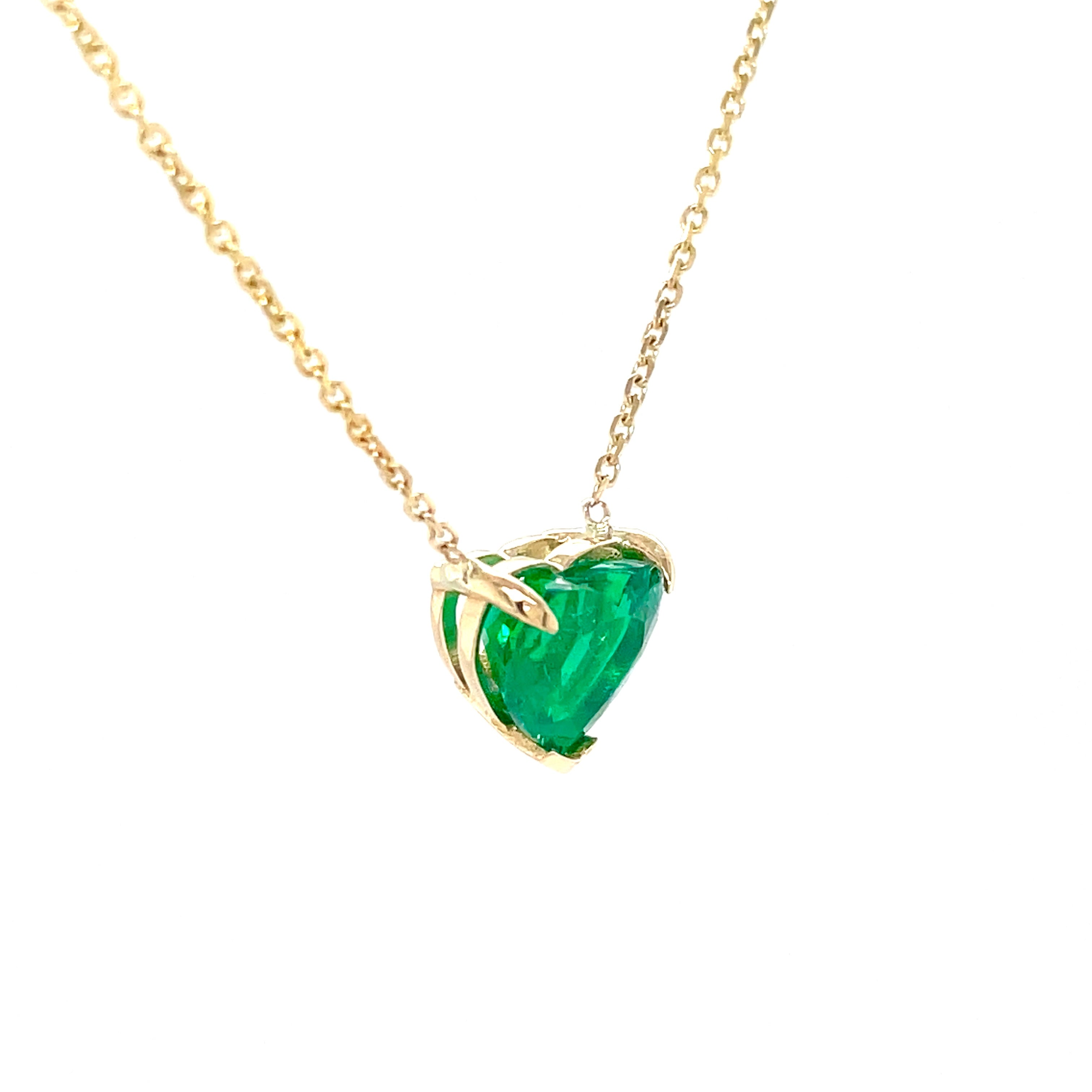 Emerald heart necklace  Perfect for Valentines   From Muzo mines  One heart shape diamond 1.90 cts  14K yellow gold basket setting  18" long.