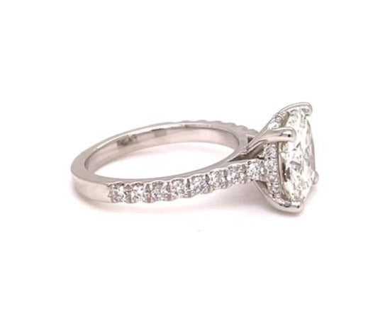 Redesigned solitaire diamond ring.  Round cut diamond 2.10 cts   Set in four prong platinum mounting with diamond band 0.50 cts 