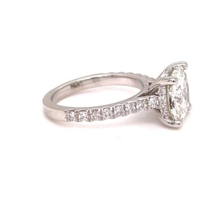 Experience a diamond ring like no other with our redesigned solitaire diamond round cut 2.10 cts. Our four prong platinum mounting is adorned with a breathtaking 0.50 cts diamond band, making it a must-have for any jewelry collection!