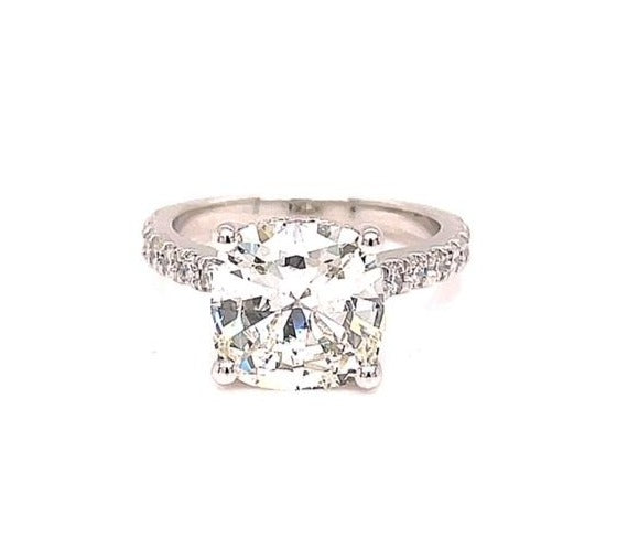 Redesigned solitaire diamond ring.  Round cut diamond 2.10 cts   Set in four prong platinum mounting with diamond band 0.50 cts 