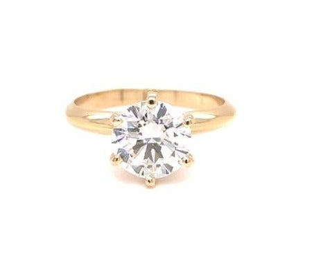 A magnificent 1.01 ct round cut diamond with G/H color and SI1 clarity is held securely in a six prong 14k yellow gold mounting, creating a timeless solitaire engagement ring!
