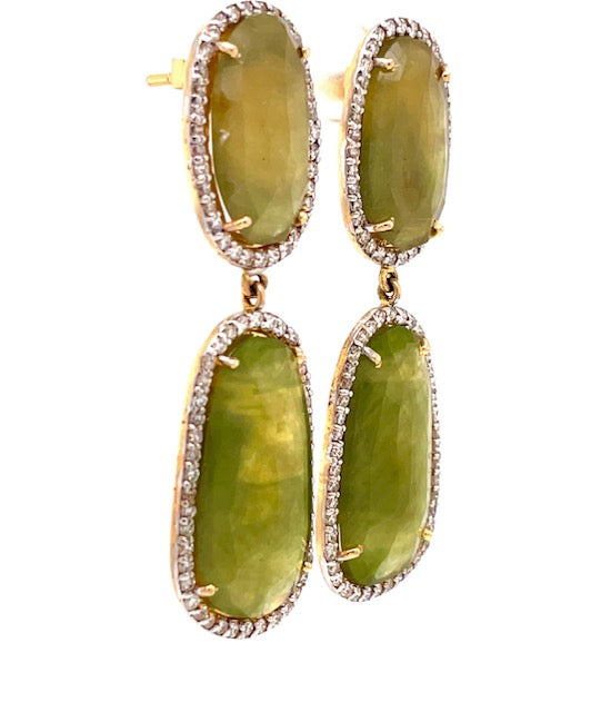 2 oval shape green sapphires 17.00 x 13.00 mm long  2 large oval green sapphires 27.00 x 15.00 mm long  Green sapphires 38.30 cts  Round diamonds 1.60 cts  Set in 14k yellow gold  Secure friction backs  2" long