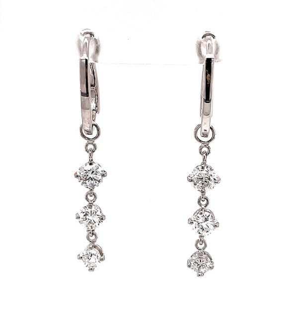 High quality diamonds  Set in 18k white gold  6 round diamonds   Total diamond weight 1.03 cts  Color F/G  Clarity VS1  Secure lever back   1.5" long  Three stone piece is detachable, You can use these earrings as huggie earrings too.